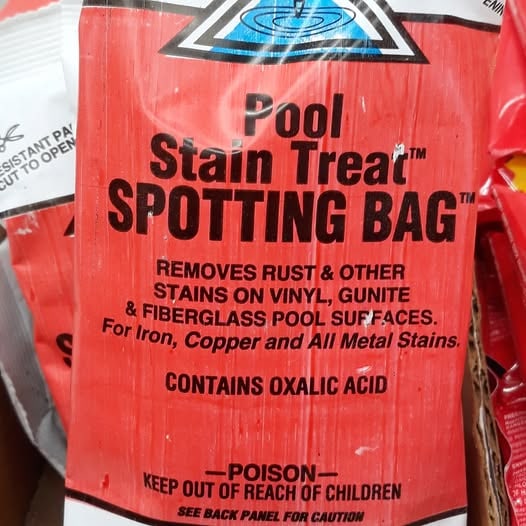 Red package labeled Pool Stain Treat Spotting Bag